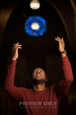 A Man Standing With Raised Hands In Church Stock Photos Pearl