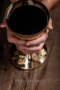 Hands Grasping A Golden Goblet Of Communion Wine Stock Photos Pearl