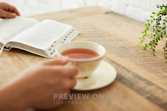 A Woman With Tea Reading A Bible Stock Photos Prixel Creative