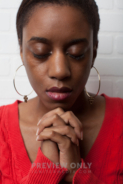 African-American Woman With Praying Hands - Stock Photos | Pearl