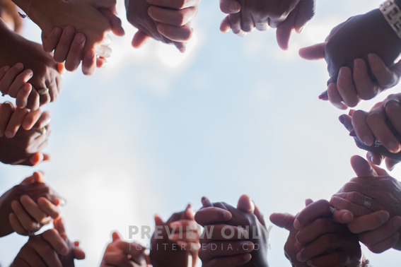 Group Holding Hands In A Prayer Circle - Stock Photos | Pearl