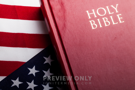 Holy Bible On An American Flag - Stock Photos 