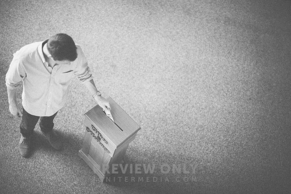 Man Placing Money In A Tithe Box - Stock Photos | Pearl