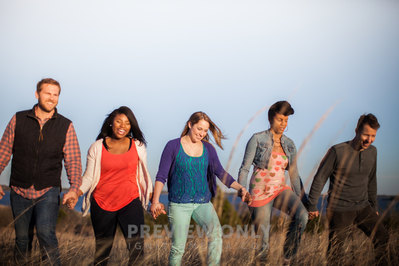 Group Of People Walking Holding Hands In Fellowship - Stock Photos | Pearl