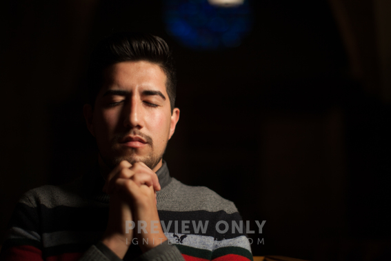 A Man With Praying Hands In Church - Stock Photos | Pearl