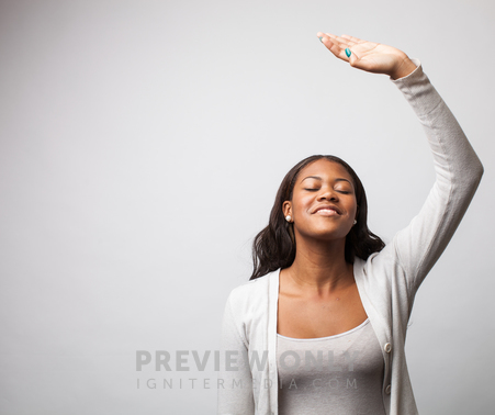 Woman Giving Praise, Raising Her Arm To The Lord. - Stock Photos | Pearl