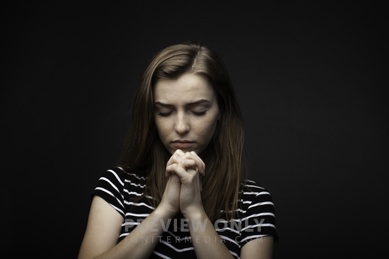 A Teen Girl In Prayer - Stock Photos | Pearl