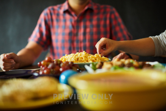 Picking At Food At A Dinner Table - Stock Photos | Prixel Creative