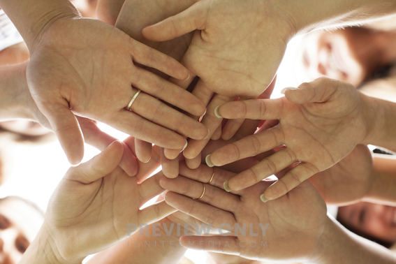 A Group Of Girls Are United As They Put Their Hands Together. - Stock ...