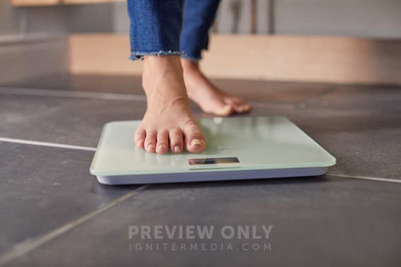 Person Getting On A Scale To Weigh Themselves - Stock Photos | Prixel