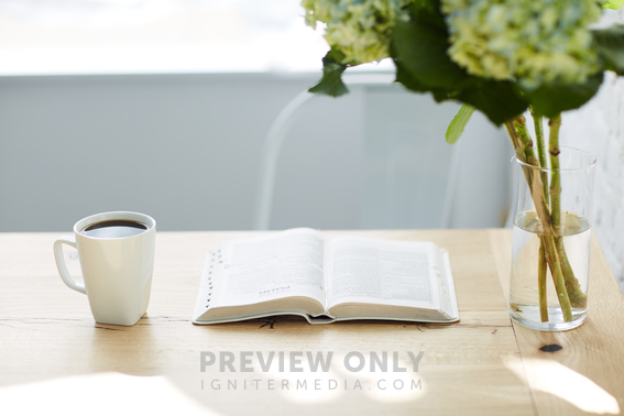 Hydrangeas In A Vase, Coffee Cup, And Open Bible On A Table - Stock ...