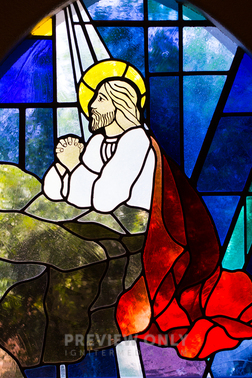 Stained Glass Window Of Jesus Kneeling In Prayer - Stock Photos | Neely ...