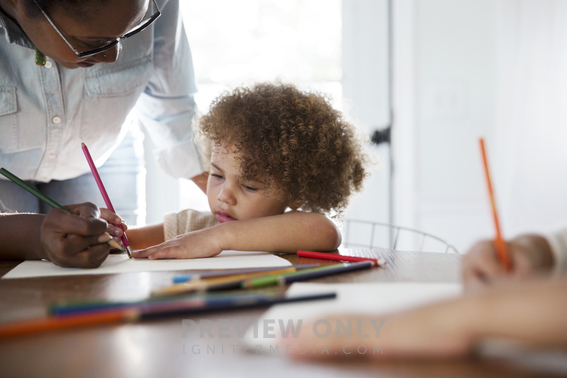 Children Coloring At The Kitchen Table - Stock Photos | Prixel Creative