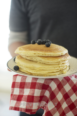 A Man Carrying A Stack Of Pancakes - Stock Photos | Prixel Creative