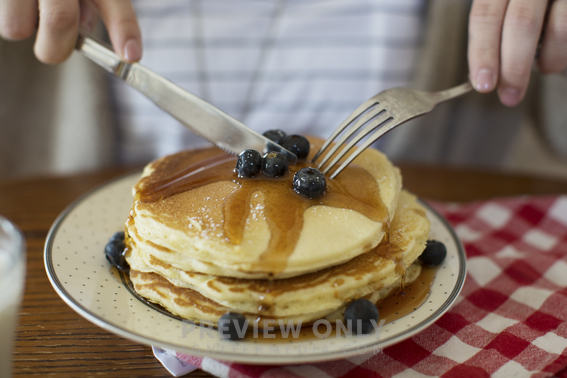 Man Eating A Stack Of Pancakes - Stock Photos | Prixel Creative