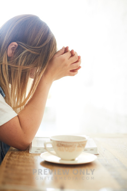 A Woman With Head Bowed In Prayer At A Table - Stock Photos | Prixel ...