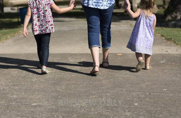 Mother And Daughters Holding Hands At A Park - Stock Photos | Prixel ...