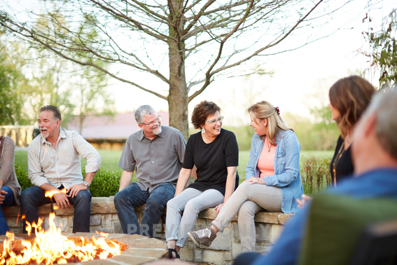 Friends Sitting Around A Fire Pit - Stock Photos | Prixel Creative