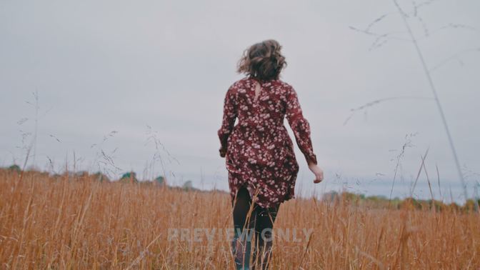 A Woman Running Through A Field - Stock Videos | Harp Creative