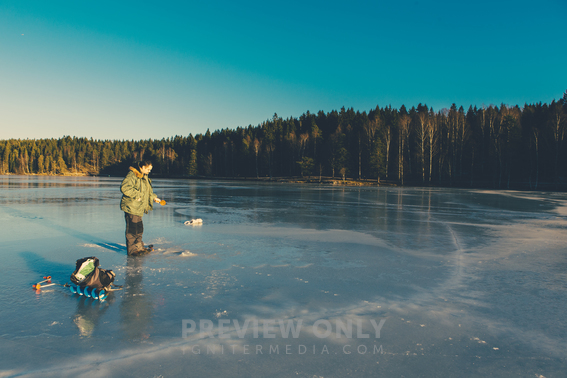 Ice Fishing On A Frozen Lake - Stock Photos | YNOTmedia