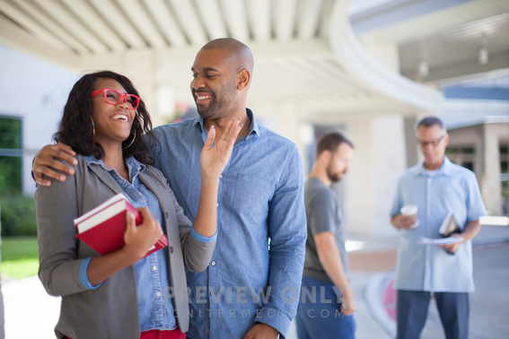 Men And Woman Holding Bibles And Talking In Front Of A Church - Stock ...