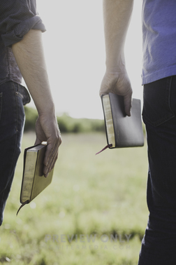 Men Holding Bibles At Their Sides Outdoors - Stock Photos | Pearl